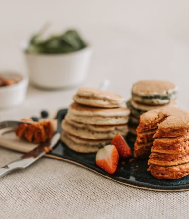 Close-up of pancakes with strawberries and almonds