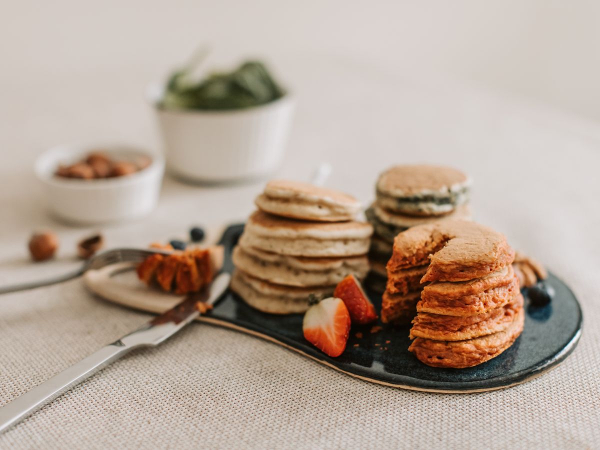Close-up of pancakes with strawberries and almonds