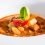 Vegetable and meat soup in a white bowl
